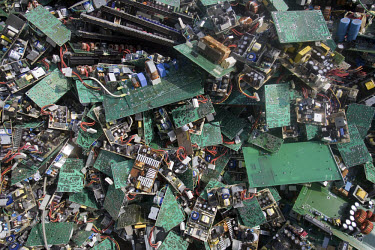 A pile of electronic trash waits to be dismantled at an e-waste recycling workshop. Every year Guiyu receives more than a million tons of computer waste from countries all over the world. About 100,00...