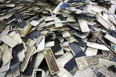 A heap of old keyboards wait to be dismantled at an e-waste recycling workshop. Every year Guiyu receives more than a million tons of computer waste from countries all over the world. About 100,000 e-...