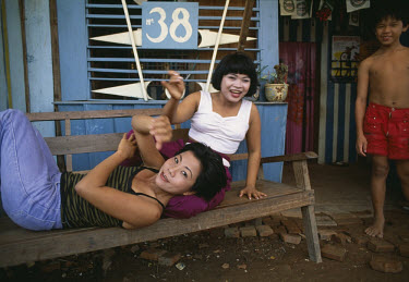 sex workers outside their brothel on the outskirts of Phnom Penh.