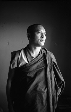 An exiled Tibetan monk in Bir. The monk was educated in his homeland under the Chinese education system, but decided to learn pure Tibetan Buddhism, which is prohibited by the Chinese authorities, in...
