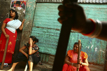 Sex workers wait with heavy sticks and a Boti (a sickle-shaped kitchen knife) determined to beat off the Islamists and land grabbers trying to evict them from the Tangail brothel. The existence of the...