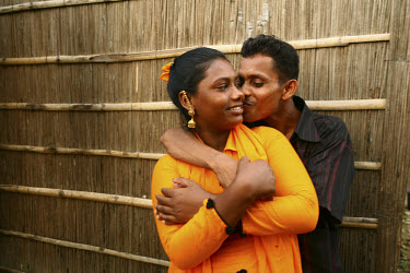 A sex worker with her boyfriend at a local brothel. Some of the women claim to have fallen in love with their clients and a few have ended up paying to support their former customers.