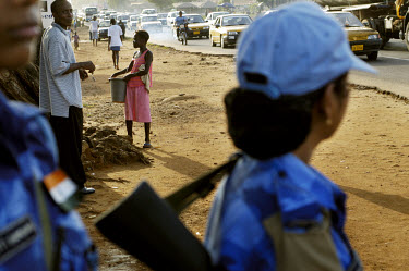 Vaishali, a female peacekeeping soldier belonging to the all-female unit of Indian UN peacekeepers in Monrovia, scans the street and passing cars while on a Joint Task Force (JTF) patrol in the Duport...