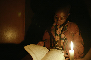 Talent goes to his uncle's house to use a candle in order to do his homework in the Nyamhuka suburb of Nyanga (known locally as the Dark City of Nyanga). There is no electric power here so those who c...