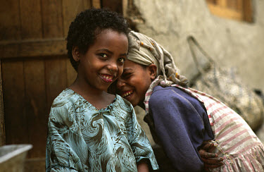 Two friends in a slum area of the city.