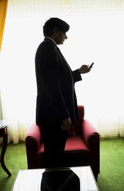 Shashi Tharoor, then Under-Secretary-General of the United Nations (USG), checks his mobile phone while on a visit to Copenhagen.