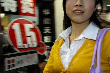 A young sex worker offering her services on Nanjing Lu, the city's famous shopping street.