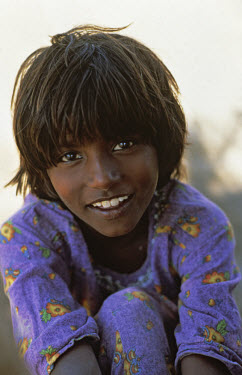 A portrait of a young girl from a rural area.