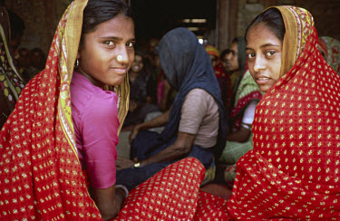Two young Gujarati girls at a women's group meeting.