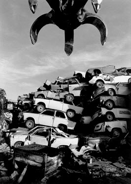 The breaking and destruction of Trabant cars at a scrap yard outside the former VEB Sachsenring Automobilwerke factory. VEB Sachsenring, an East German car manufacturer, ceased production of its iconi...