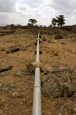 A water pipeline running through the semi-arid countryside. The pipeline, which was installed by WaterAid, is fed by a spring and now supplies water to a population of around 72,000.