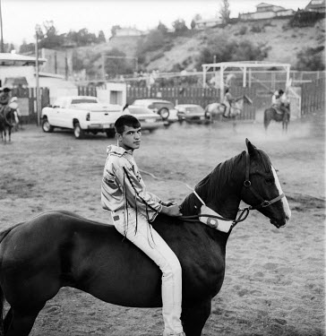 Tony Marchand sitting on his horse Skookum before the third Suicide Race of the Championship. He won this race and went on to finish runner up in the overall competition. The Omak Suicide Race is part...