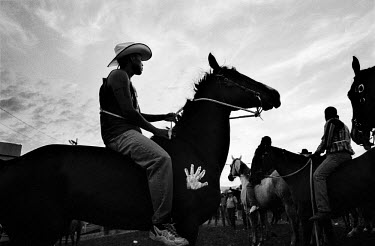 Suicide Racers on horseback prepare to enter the Omak Stampede arena before the start of the race. The Omak Suicide Race is part of the Omak Stampede, a rodeo which is held on the Colville Native Amer...