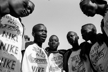 A team huddle before the men's volleyball finals. 3,000 young competitors and spectators came together in Twic county, southern Sudan, to compete in the first Twic Olympic Games. The event allowed man...