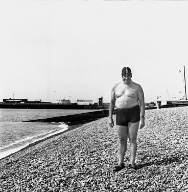 Steve Smith, Taxi Driver and Cross Channel Swimming hopeful.  Standing on the pebble beach in Dover Harbour before a grueling six hour training session within the harbour walls.