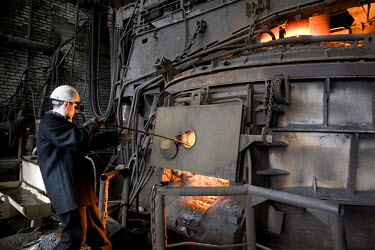 A worker supervising the steel melting process in a furnace at the Norilsk Nickel factory. The Norilsk Nickel Corporation in Monchegorsk is known as one of the most polluting companies in Russia. Ther...