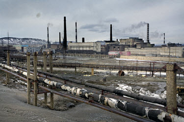 The Norilsk Nickel factory. The Norilsk Nickel Corporation in Monchegorsk is known as one of the most polluting companies in Russia. There is almost nothing is growing for miles around the factory bec...