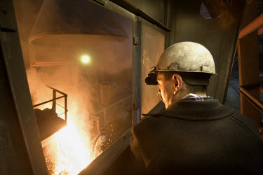 A worker supervising the steel melting process in a furnace at the Norilsk Nickel factory. The Norilsk Nickel Corporation in Monchegorsk is known as one of the most polluting companies in Russia. Ther...