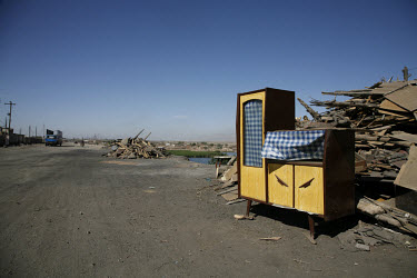 An abandoned cabinet stands on the side of a road in northern Ningxia Hui Autonomous Region.