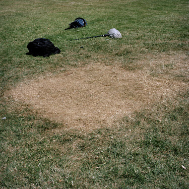Brown patch of grass left by a TV crew's tent in Abingdon Street Gardens. Often referred to as College Green, Abingdon Street Gardens is the small patch of land that lies next to the Houses of Parliam...