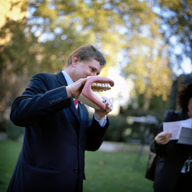 A photocall with an MP holding a novelty toy mouth. Abingdon Street Gardens, often referred to as College Green, is the small patch of land that lies next to the Houses of Parliament in Westminster, L...