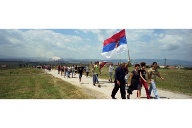 Serbs walk to the Gazemestan monument for a religious service in commemoration of the Battle of Kosovo Field in 1389. Every year Serbs visit the site to hold a religious ceremony commemorating the bat...