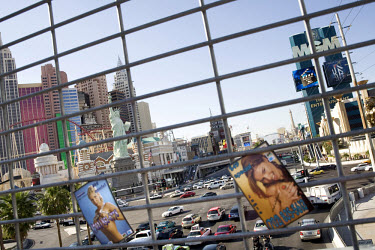 Advertisement cards for sex workers posted near the MGM Grand and the half-size Statue of Liberty replica at the New York-New York Hotel & Casino on Las Vegas Boulevard (also known as The Strip).