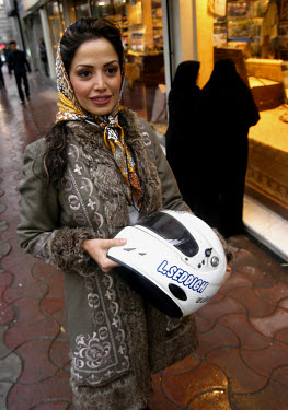 A portrait of Laleh Seddigh with her crash helmet. Seddigh is Iran's best female racing car driver.