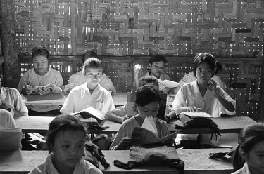 5th grade girls studying at the Karenni Government High School for refugees from Burma. Subjects studied include Kayah, English and Burmese languages, mathematics, geography, history and science. Inst...