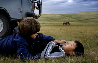 Rowan, a five-year-old autistic child, communicates with six-year-old Bodibilguunson, the son of a guide, during a horseback expedition across Mongolia. Rowan, who has been nicknamed ^The Horse Boy^,...