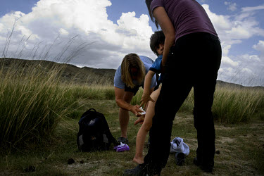 Rowan, a five-year-old autistic child, is cleaned by his parents after soiling his pants during a horseback expedition across Mongolia. Rowan, who has been nicknamed ^The Horse Boy^, embarked on a the...