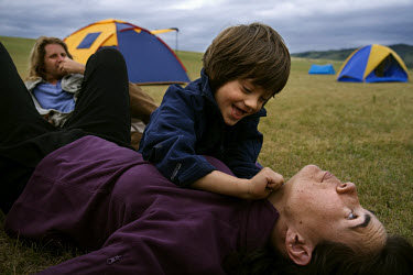 Rowan, a five-year-old autistic child, playing with his parents during a horseback expedition across Mongolia. Rowan, who has been nicknamed ^The Horse Boy^, embarked on a therapeutic journey of disco...