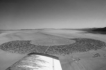 Aerial view of Black Rock City, the temporary city constructed by visitors to the Burning Man Festival. Each year tens of thousands of people amass in the Nevada desert to take part in what organisers...