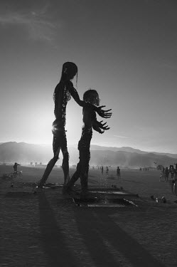 Art pieces stand in Nevada's Black Rock Desert as part of the Burning Man Festival. Each year tens of thousands of people amass in the Nevada desert to take part in what organisers describe as an expe...