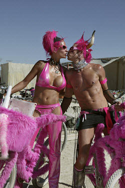 A couple in pink pose in Nevada's Black Rock Desert as part of the Burning Man Festival. Each year tens of thousands of people amass in the Nevada desert to take part in what organisers describe as an...