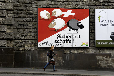 'Black sheep' political poster for the right wing Swiss Worker's Party (SVP/UDC), which many have charged, including a graffiti writer, with being racist and xenophobic. It refers directly to a propos...