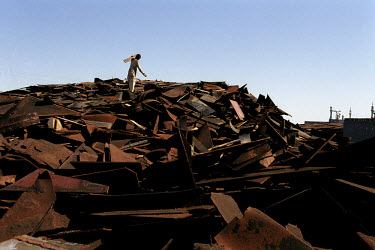 Workers dismantle a huge ship and carry it off piece by piece at the ship-breaking yard in Gaddani.