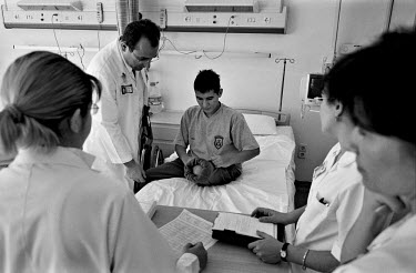 Doctors treat a patient at the army rehabilitation centre in Ankara. Eastern Turkey is blighted by landmines. During the 1950s, the cause was illegal border trading; in the 1990s, the cause was war wi...