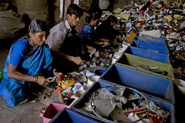 People work in a plastic recycling unit in the Dharavi slum.