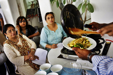 Women attend a cooking class at the Saltz restaurant. The class focuses on healthier recipes. As new processed foods have become available in India to the wealthy and upper middle classes, obesity rat...