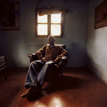 Joao sits alone in his living room. With the help of the NGO Khalira, Joao had himself tested for HIV. He was found possitive and is now receiving ARV (Antiretroviral drugs) therapy.
