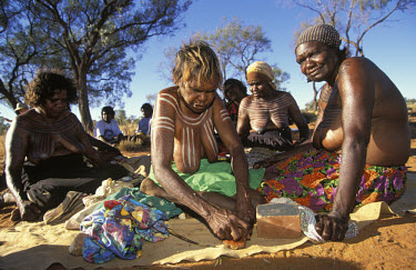 Aboriginal artists paint each other for a corroboree, a ceremonial meeting of Aborigines, in South Australia.