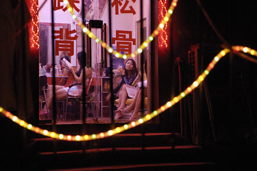 sex workers waiting for business in a brothel fronting as a hair dressing salon in the Central Business District. Prostitution, although illegal, is a massive industry and there are thousands of such...