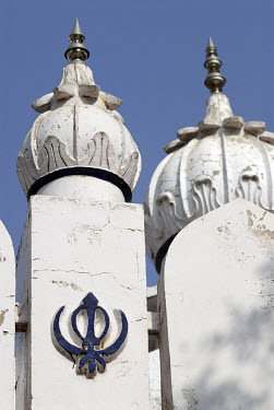 Rural village Gudwara (Sikh temple) featuring the holy symbol of Sikhism - the Khanda.