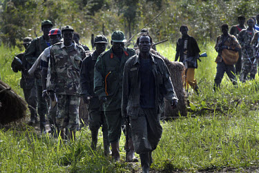 Lord's Resistance Army (LRA) leader Joseph Kony (fourth from front) and his soldiers arrive at peace talks near the Congolese border. For the last two decades Joseph Kony and the Lord's Resistance Arm...