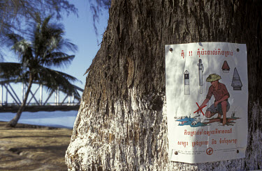 Public education poster warning of the dangers of UXO (unexploded ordinance) and mines.