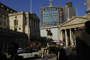 Equestrian statue flanked by the Bank of England on the left and the Royal Exchange on the right, in the City of London.