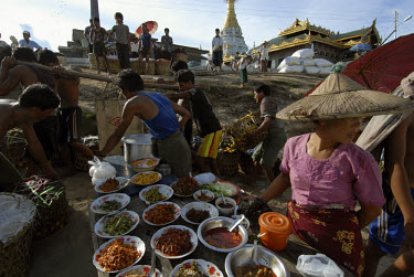Hawkers sell traditional Burmese food in Katha, on the banks of the Ayeyarwaddy (Irrawaddy) River. It was in Katha, that George Orwell spent several years as a soldier, and from where he drew the insp...
