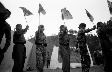 Young Maoists perform a dance in a village in Ropla District, one of the Maoist strongholds during the 1996 - 2006 civil war.