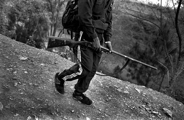 Maoist with his rifle in a village in Rolpa District, one of the Maoist strongholds during the 1996 - 2006 civil war.